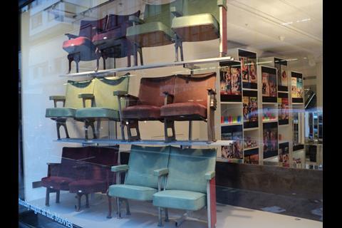 The four windows that front the store’s “Wonder Room” at the western end of the building have a series of curious ‘installations.